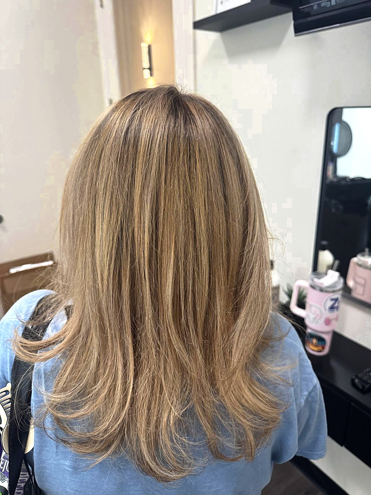 Blonde hair at the salon, back view