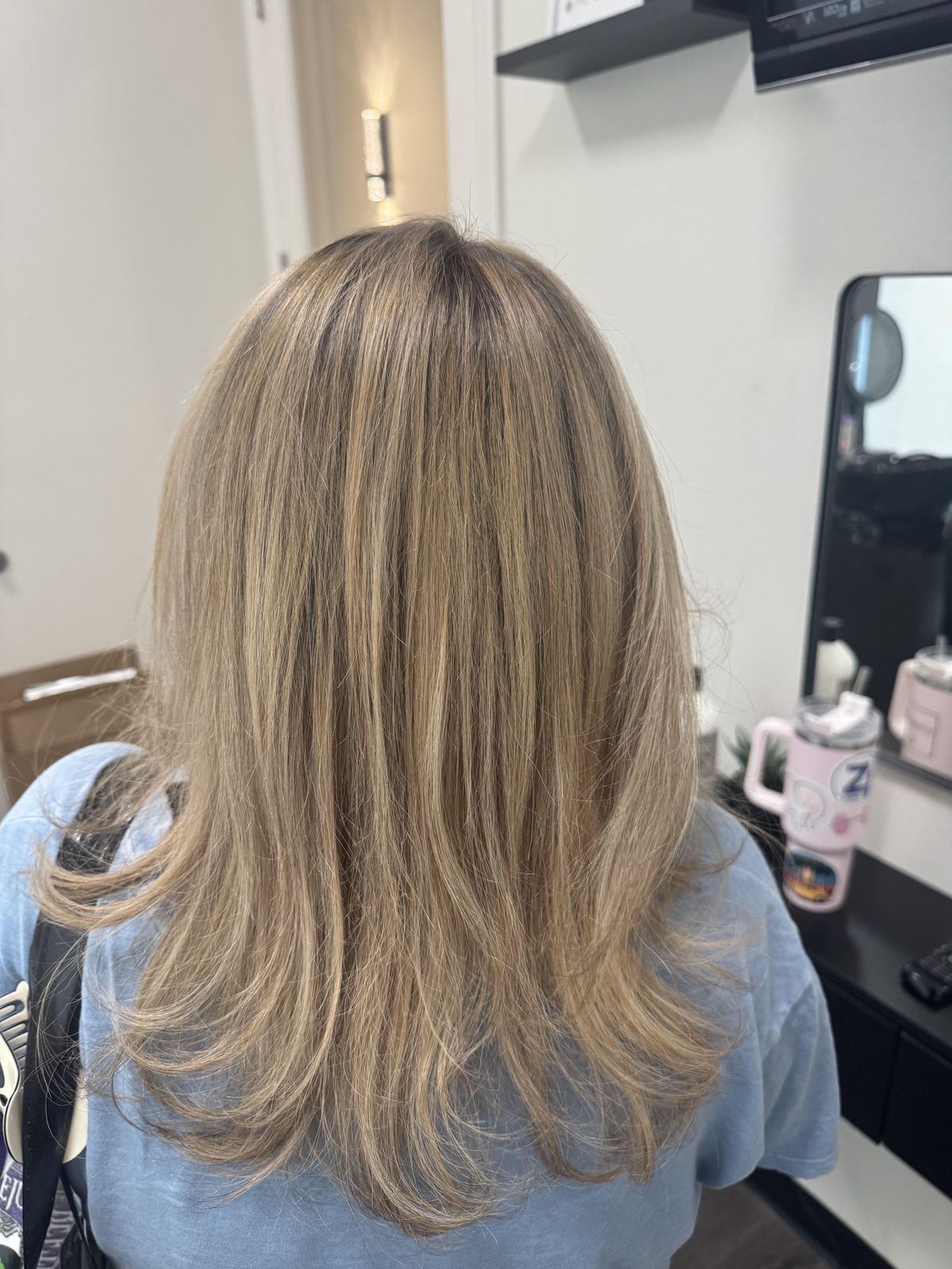 Blonde hair at the salon, back view