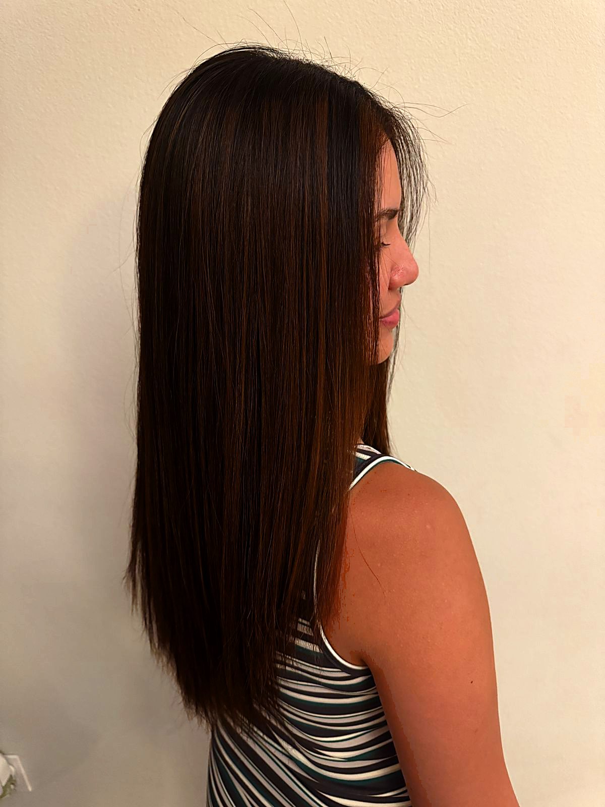 Long straight brown hair, side view