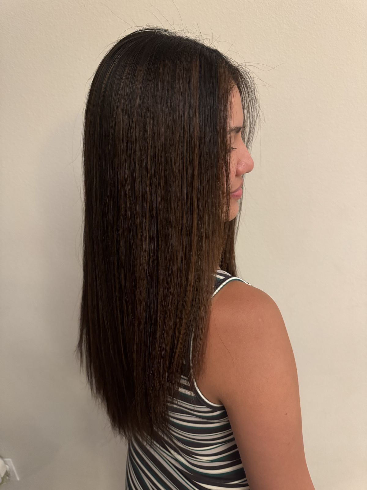 Long straight brown hair, side view